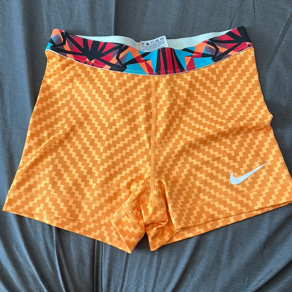Nike pro dri fit shorts goldish orange patterned band